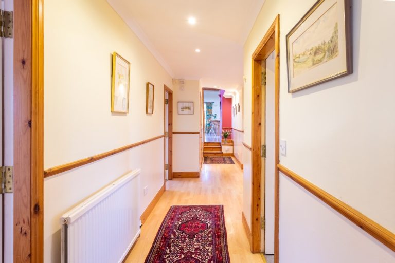 Warm ambience reflect in the hallway of our large holiday villa for your holiday rental in Glasgow neighborhood